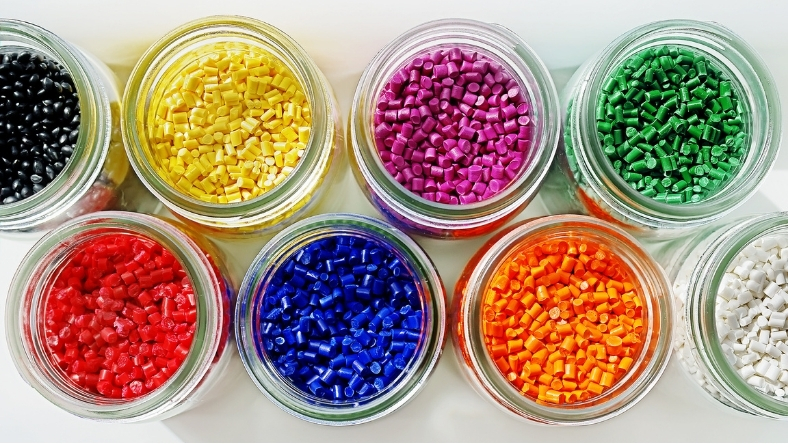 Plastic pellets in multiple colours used for packaging materials research