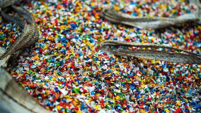 Colorful recycled plastic flakes prepared for industrial reuse