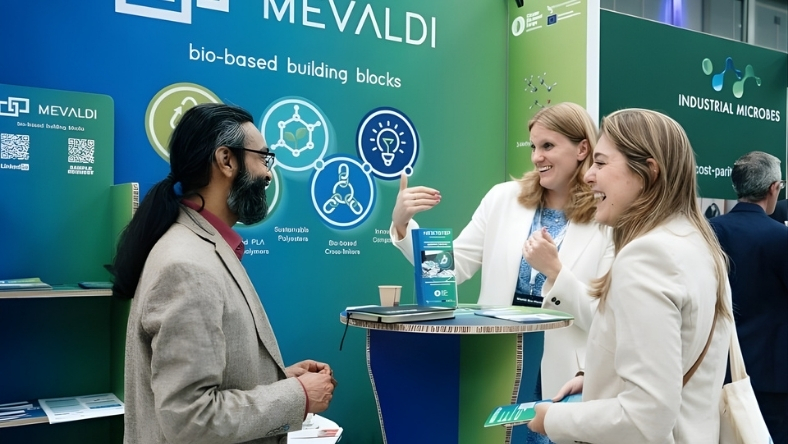 Mevaldi team discussing bio-based polymers at trade booth